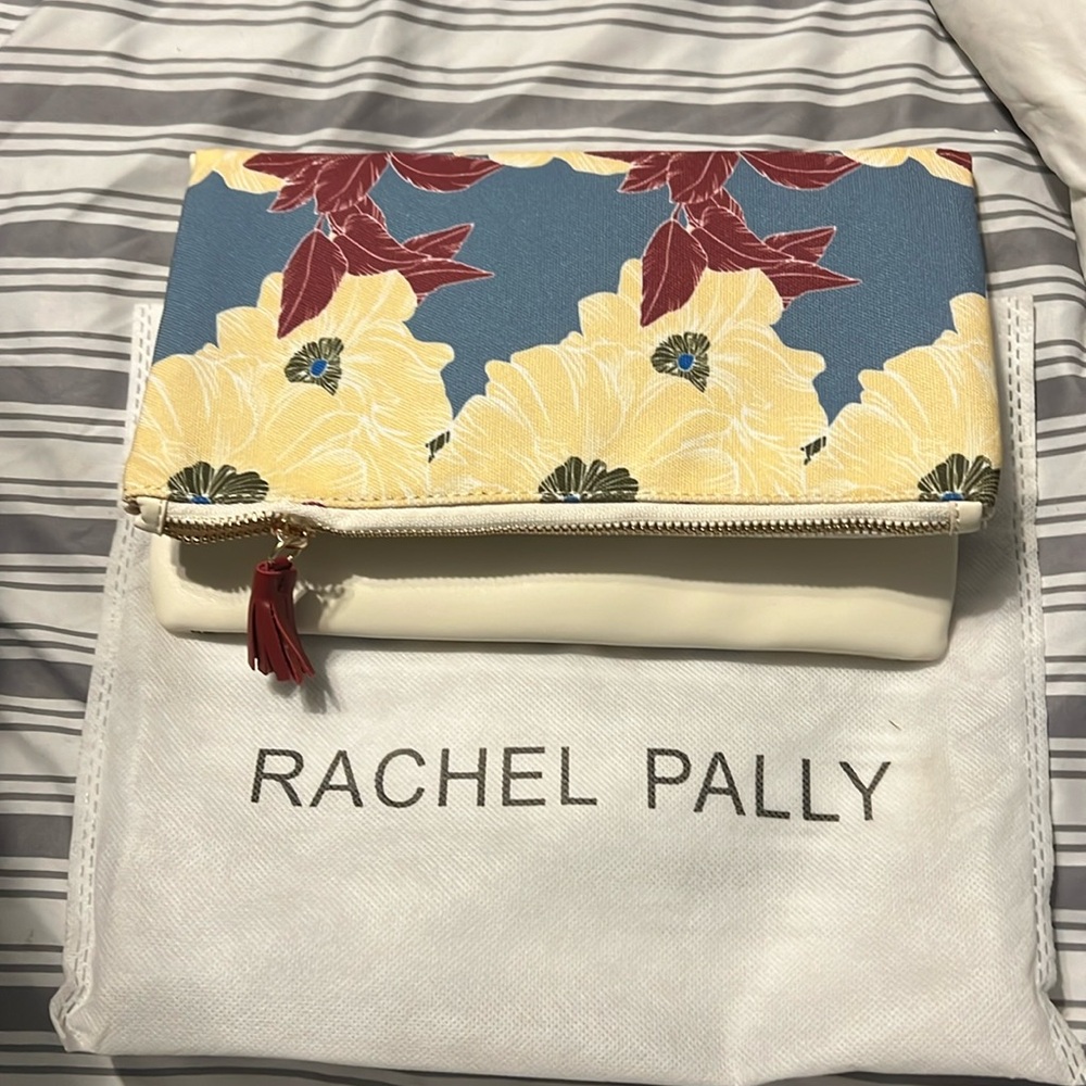 Adorable clutch purse with case…never used…the colors are light